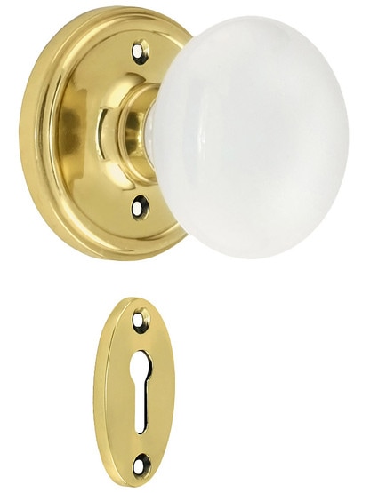 Classic Rosette Mortise Lock Set With White Porcelain Door Knobs in Polished Brass.